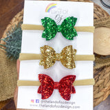 Set of three coordinating glitter baby bow headbands in perfect colours for the holidays!