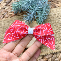 Adorable candy cane heart bows perfect for Christmas!