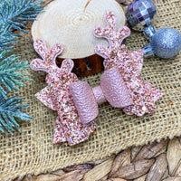 Gorgeous super sparkly pink and rose gold reindeer bows, perfect for Christmas!