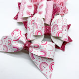 Adorable pink conversation candy heart bows, perfect for Valentine's Day!