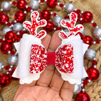 Super sparkly red andnwhite glitter and faux fur reindeer bows, perfect for Christmas!