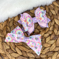 Adorable bright pastel rainbow print bows!