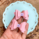 Adorable pigtail bows with happy daisy embellishments!