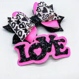 Black and white graffiti heart/XO print and bright pink glitter bows, perfect for Valentine's Day!