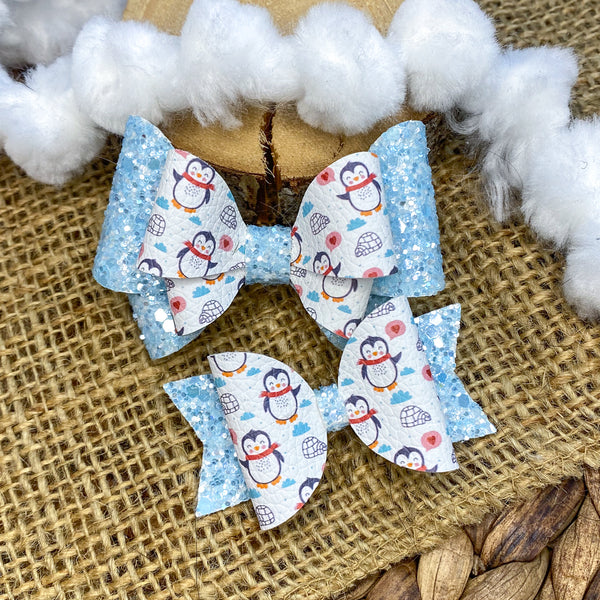 Adorable blue glitter and penguin print bows!