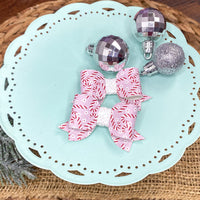Adorable pink candy cane bows, perfect for the holidays!