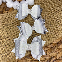 Beautiful silver and white glitter snowflake bows!