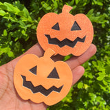 Adorable and super sparkly jack o' lantern snap clips, perfect for Halloween!