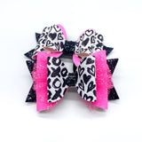 Black and white graffiti heart/XO print and bright pink glitter bows, perfect for Valentine's Day!