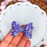Gorgeous chunky and fine glitter 2" stacked pigtail bows!