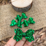 Super sparkly glitter pigtail bows perfect for St Patrick's Day!