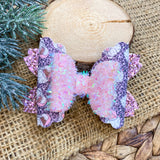 Adorable pink and purple leopard print Santa bows, perfect for Christmas!