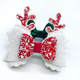 Super sparkly red andnwhite glitter and faux fur reindeer bows, perfect for Christmas!
