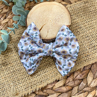Gorgeous sunflower print fabric bow clips or headbands.