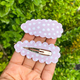 Beautiful neutral print faux leather scalloped peek a boo snap clips!