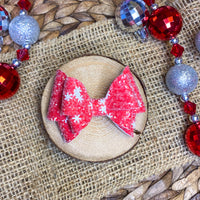 Sparkly red or green  snowflake glitter bows, perfect for the holidays!