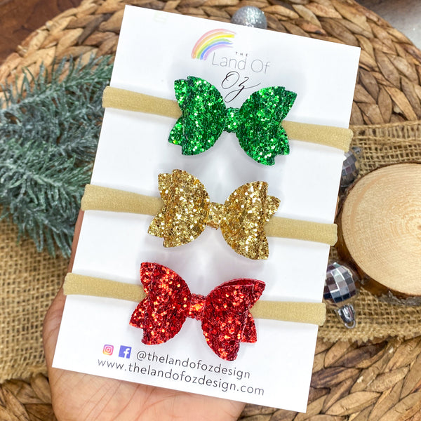 Set of three coordinating glitter baby bow headbands in perfect colours for the holidays!