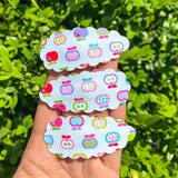 Adorable scalloped snap clips in cute prints perfect for back to school!