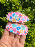 Fun bright leopard print or glitter scalloped snap clips!