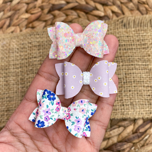 Adorable floral or glitter tiny pigtail bows!