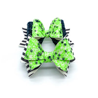 Ghoulishly great glow in the dark glitter and black and white striped bows!