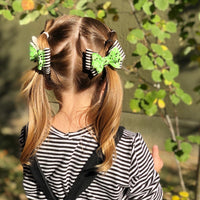 Ghoulishly great glow in the dark glitter and black and white striped bows!