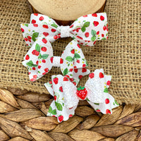 Adorable summery wild strawberry print faux leather bows!