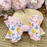 Beautiful pale pink butterfly and lemon print faux leather bows!