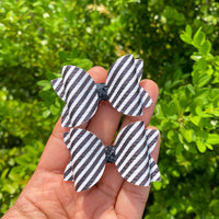 Adorable monochromatic 2" pigtail bows in adorable prints and patterns!