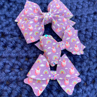 Adorable tiny purple unicorn bows!