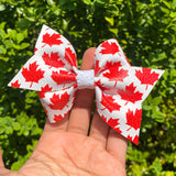 Red and white maple leaf bows, perfect for Canada Day