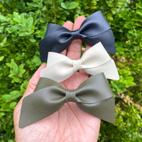 Beautiful smooth faux leather bows in gorgeous neutral earth tones