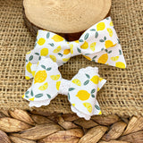 Beautiful bright and summery lemon print faux leather bows!