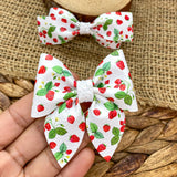 Adorable summery wild strawberry print faux leather bows!