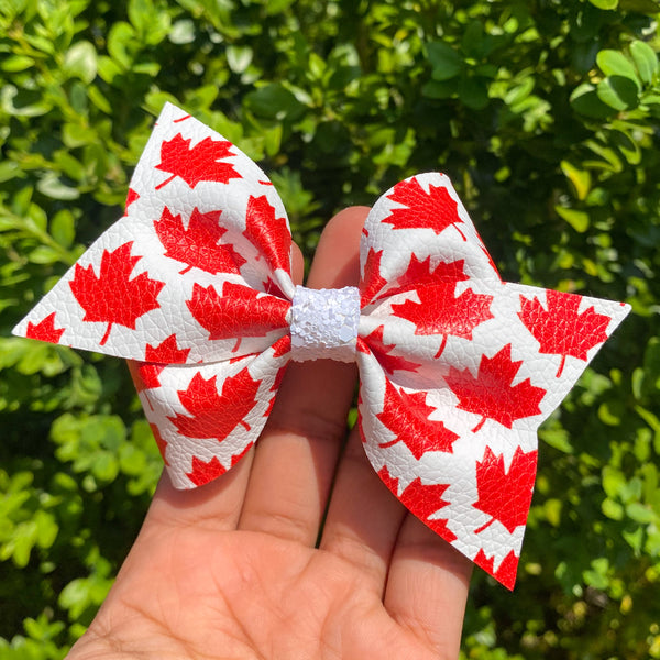 Red and white maple leaf bows, perfect for Canada Day