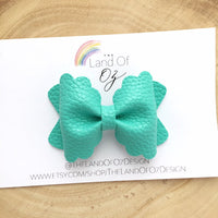 Adorable bright pastel coloured faux leather bows! Pink, turquoise and yellow scalloped pinch and Ella bows
