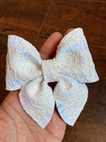 Gorgeous glitter lace bows in pretty pastel shades.