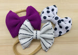 Adorable polkadot or solid colour bullet fabric bow clips or headbands.