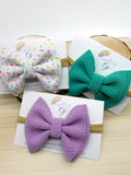 Adorable sprinkle or solid colour bullet fabric bow clips or headbands Liverpool fabric birthday sprinkle cake smash bow