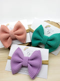 Adorable sprinkle or solid colour bullet fabric bow clips or headbands Liverpool fabric birthday sprinkle cake smash bow