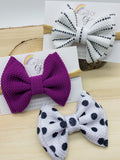 Adorable polkadot or solid colour bullet fabric bow clips or headbands.