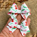 Adorable heart shaped cherry bows!