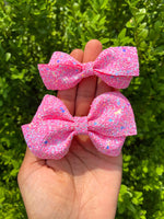 Super sparkly bright pink chunky glitter bows