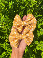 Gorgeous mustard floral nylon fabric bow clips or headbands.