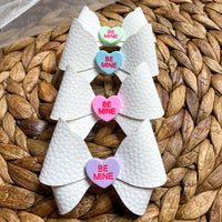 Adorable candy conversation heart bows, perfect for Valentine's Day!