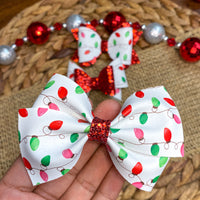 Festive multicolour Christmas light print bows, perfect for the holidays!