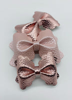 Classic and elegant pink pearl or metallic scalloped pinch bows!
