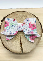 Pretty pastel floral bows in many different styles!