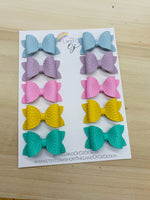 Small pigtail bow clips in pretty pastel colours