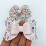 Gorgeous muted multicolour heart bows!